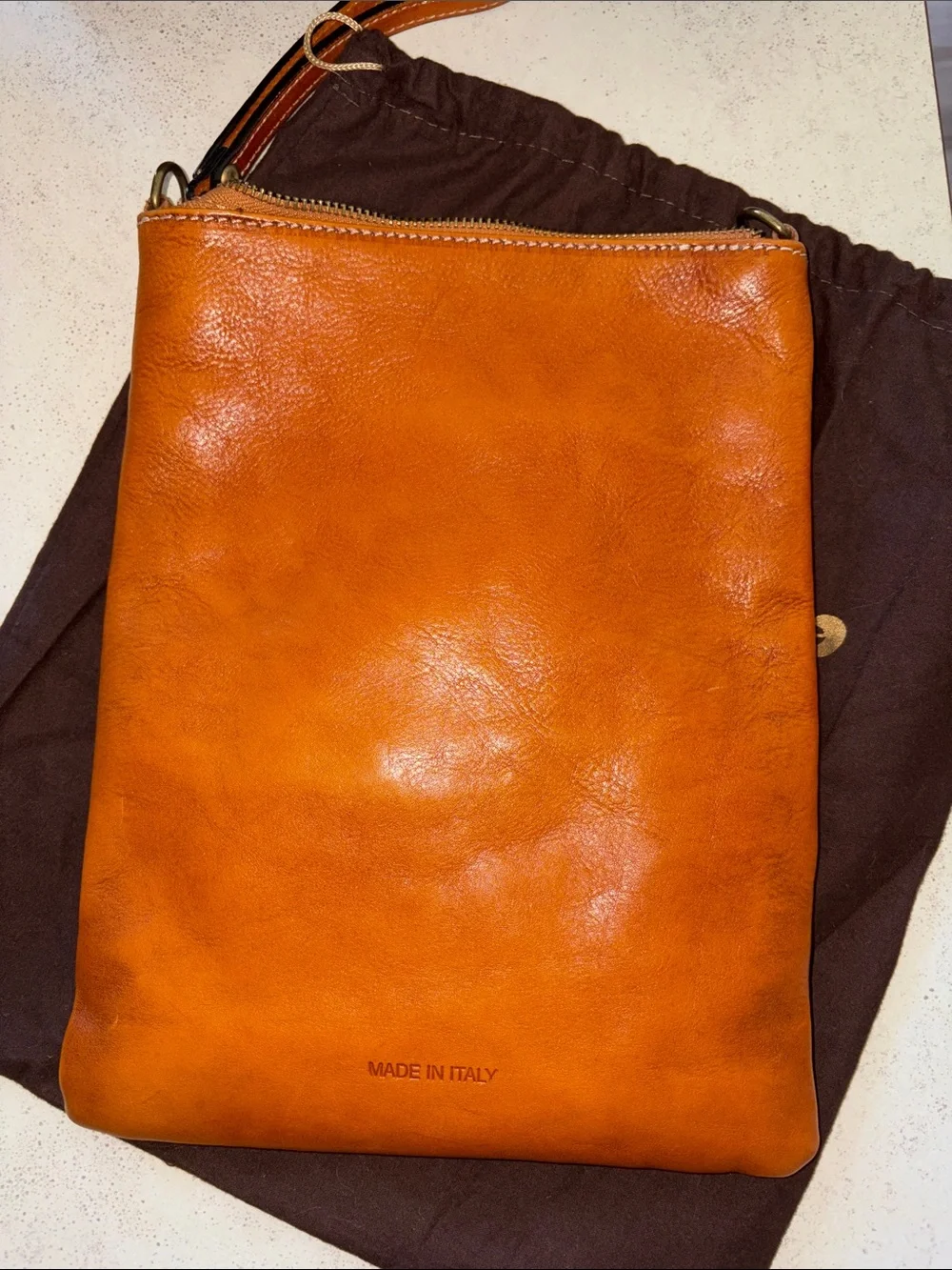 Studded Leather Wristlet Clutch in Cognac with Crest Emblem